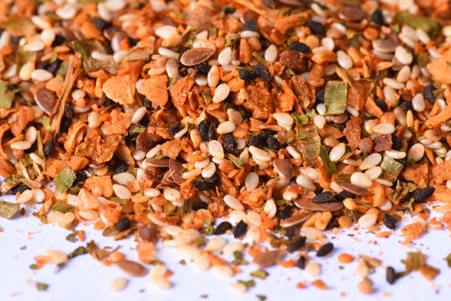 Close-up of mixed spice blend with sesame seeds, dried herbs, and seasoning flakes