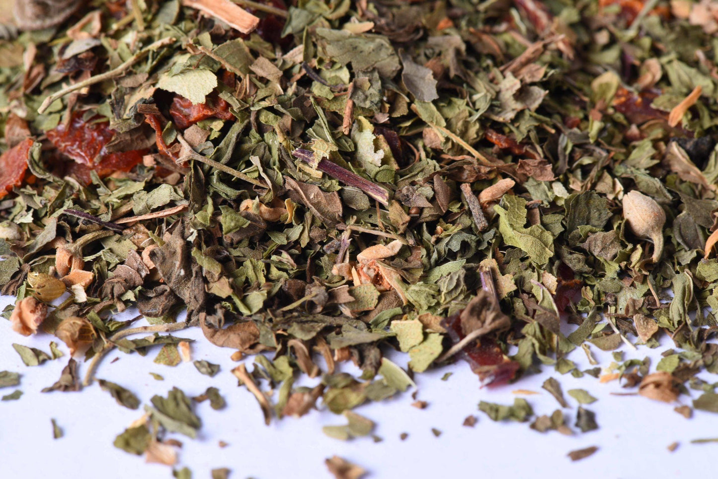 Close-up of loose-leaf herbal tea blend with dried leaves and spices