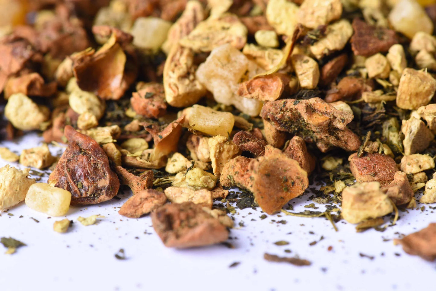 Close-up of loose-leaf herbal tea blend with dried fruit and spice pieces