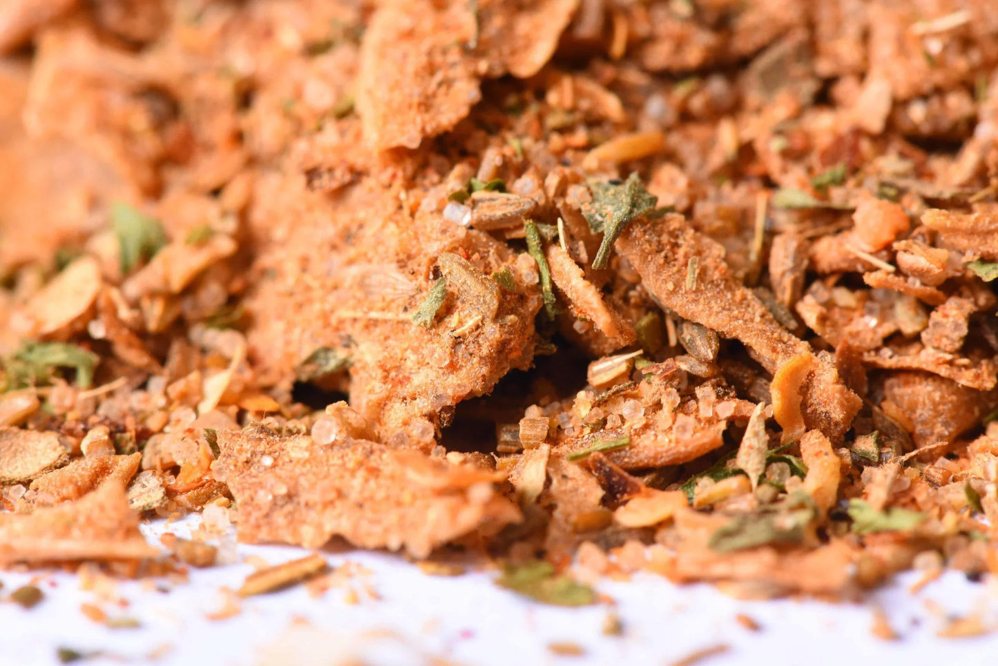 Close-up of a gourmet spice blend with dried herbs and seasoning flakes