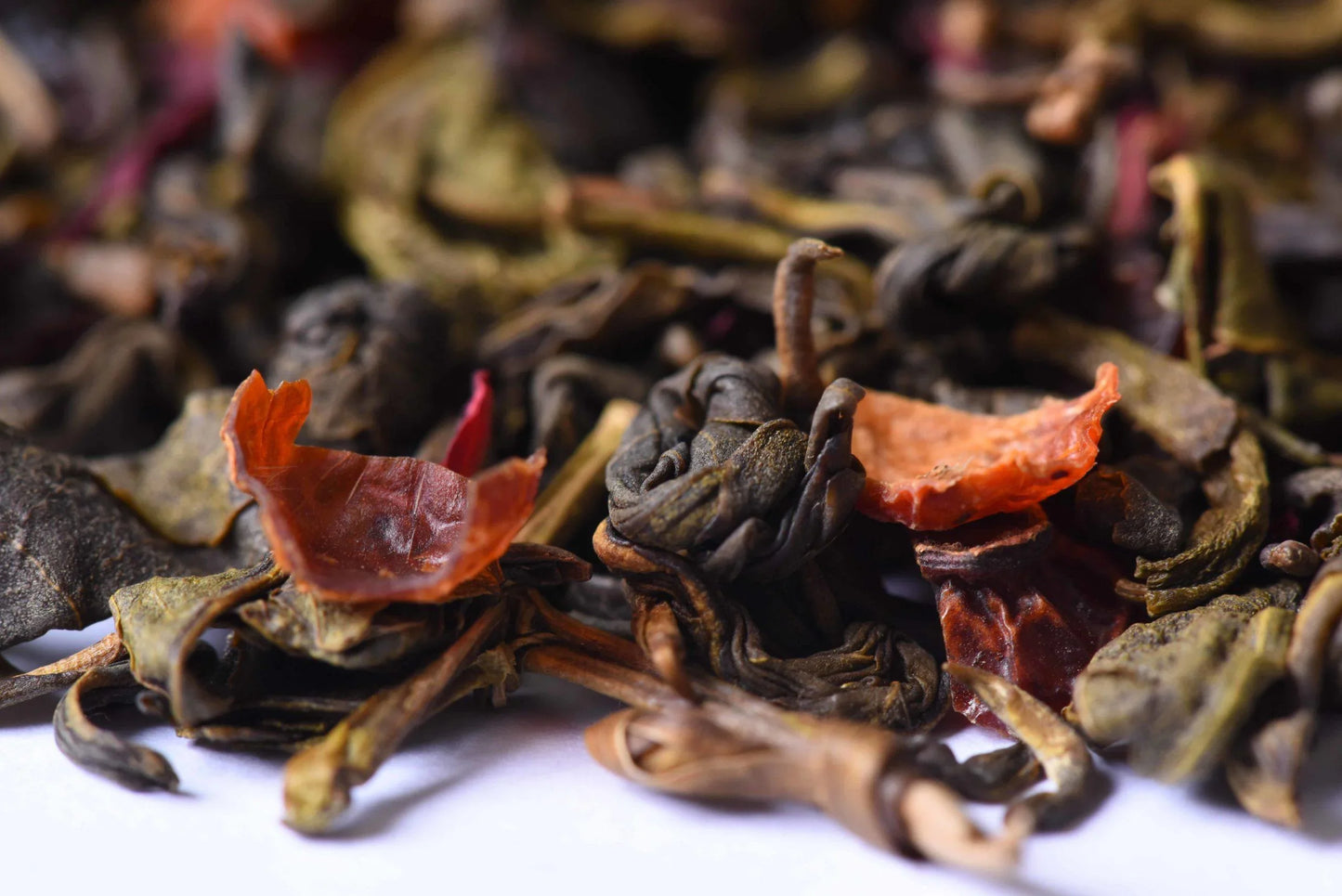 Closeup of loose-leaf gourmet tea blend with dried fruit and herbs