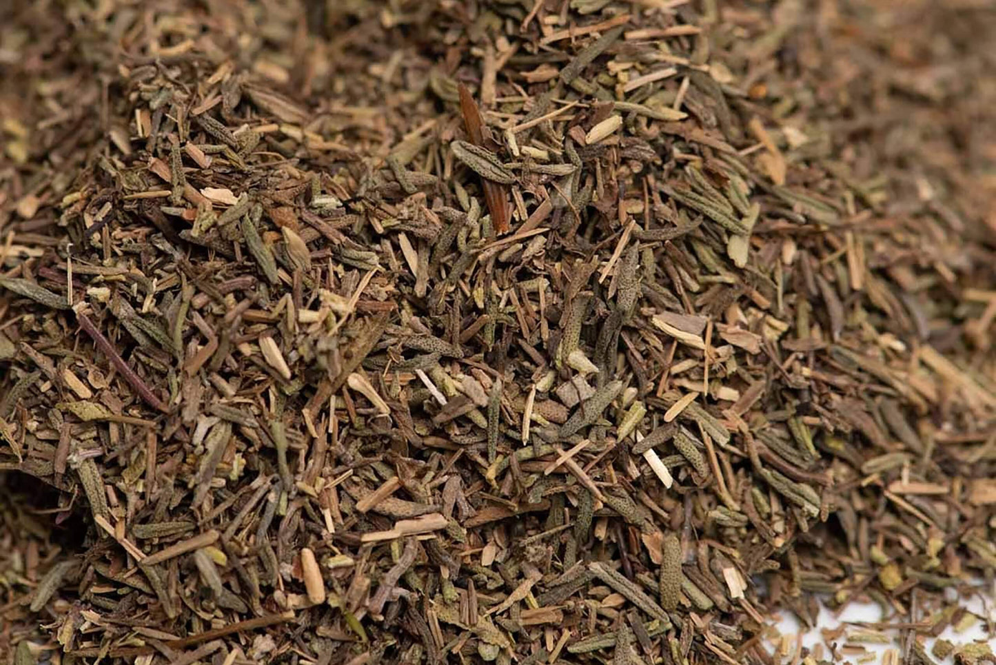Close-up of dried herb blend with mixed green and brown seasoning pieces
