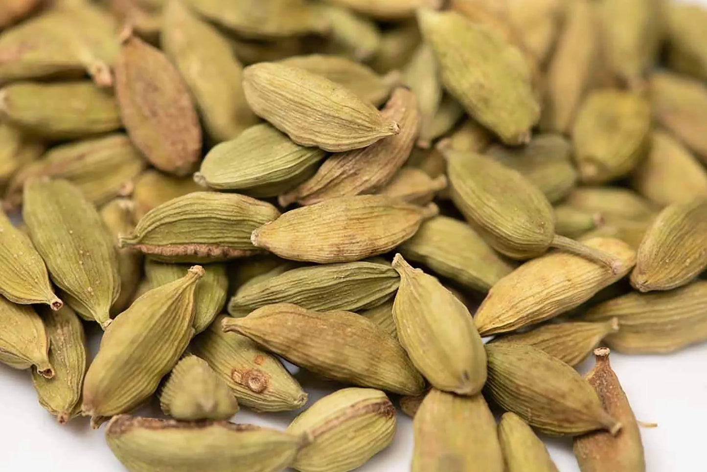 Whole green cardamom pods close-up, aromatic spice for cooking and tea blends