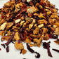 Assorted dried tea leaves on a white background