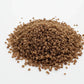 Brown granular salt on a white background