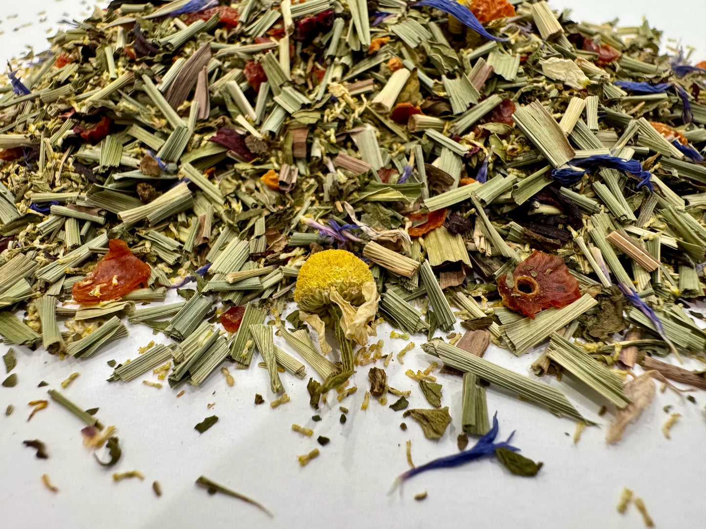Mixture of dried herbs and flowers on a white background