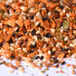 Close-up of mixed spice blend with sesame seeds, dried herbs, and seasoning flakes