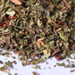 Close-up of loose-leaf herbal tea blend with dried leaves and spices