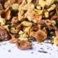 Close-up of loose-leaf herbal tea blend with dried fruit and spice pieces