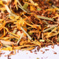 Loose-leaf herbal tea blend with dried flowers, lemongrass, and natural ingredients