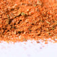 Close-up of vibrant gourmet spice blend with herbs and seasonings on white background