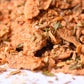 Close-up of a gourmet spice blend with dried herbs and seasoning flakes