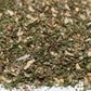 Close-up of dried herb and spice blend mix, showing chopped green and white pieces