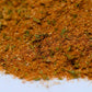 Close-up of blended spice mix with herbs and seasoning on white background